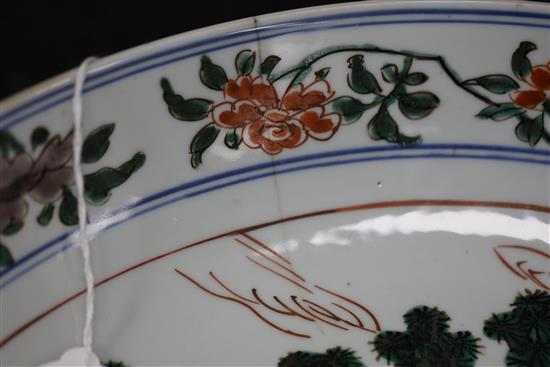 A Chinese famille verte dish, Kangxi period, D. 36cm, cracked